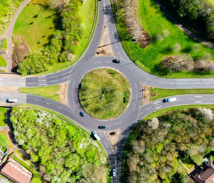 Aerial view of vehicles navigating a large roundabout