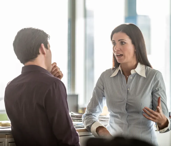 Two colleagues discussing grey fleet compliance